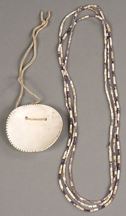 white oval shell pendant and string of shell beads