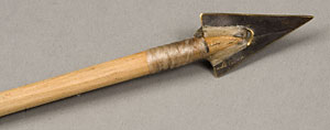 brass arrow head on wooden shaft