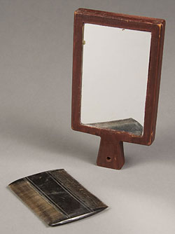 bone comb and wooden framed mirror