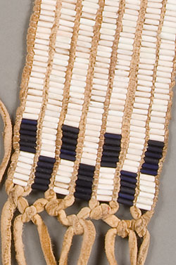 belt of white beads carved from shell