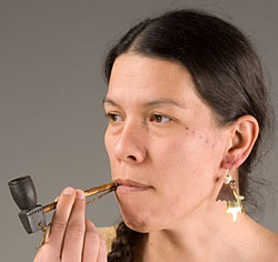 woman with small stone pipe