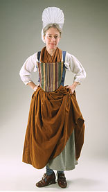 model wearing warm brown skirt and earth-toned striped stomacher