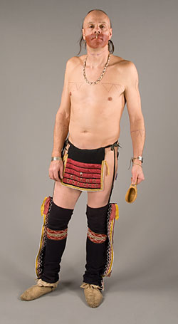 man wearing breechcloth, leggings and moccasins