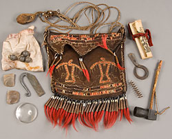 decorated leather pouch surrounded by objects
