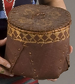 brown covered basket made of bark