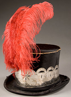 black top hat with silver trim and red feather