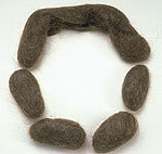 a set of hair rats--brown oblong balls of hair