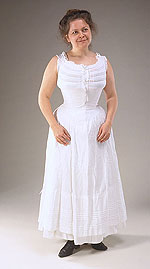 woman wearing long white gauzy cotten petticoat and white cotton camisole