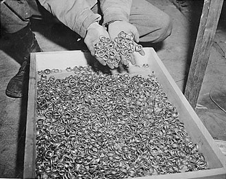file:/activities/oralhistory/cappics/cohen1945_rings, alt: box full of wedding bands