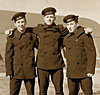 Slater and two young men dressed in Navy uniforms